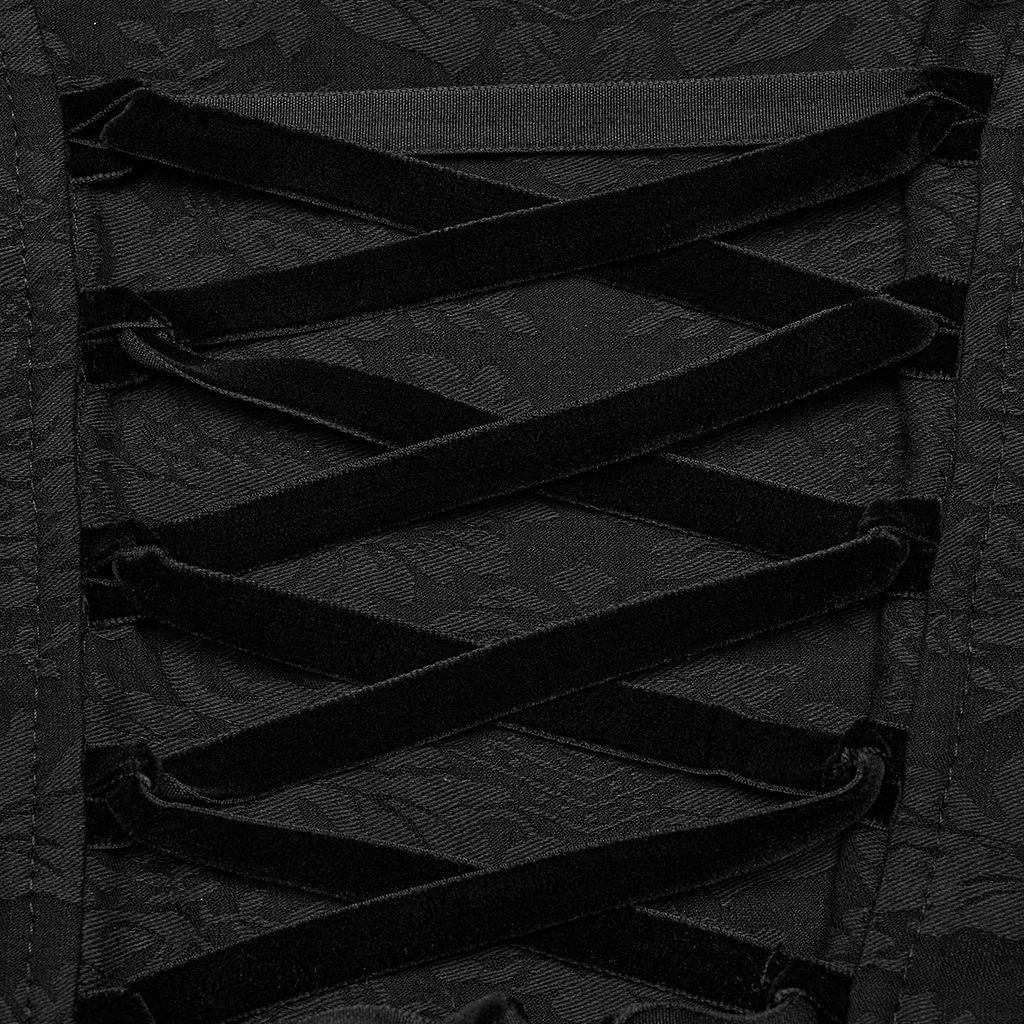 Close-up of black jacquard lace fabric with intricate corset-style lacing detail for gothic blouse.