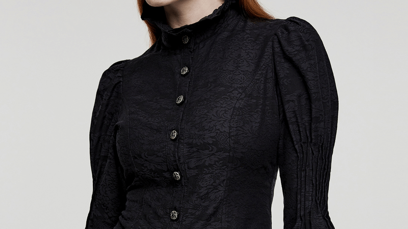 Victorian-inspired black goth blouse featuring ruffle trim, lace detail, and elegant puffed sleeves.