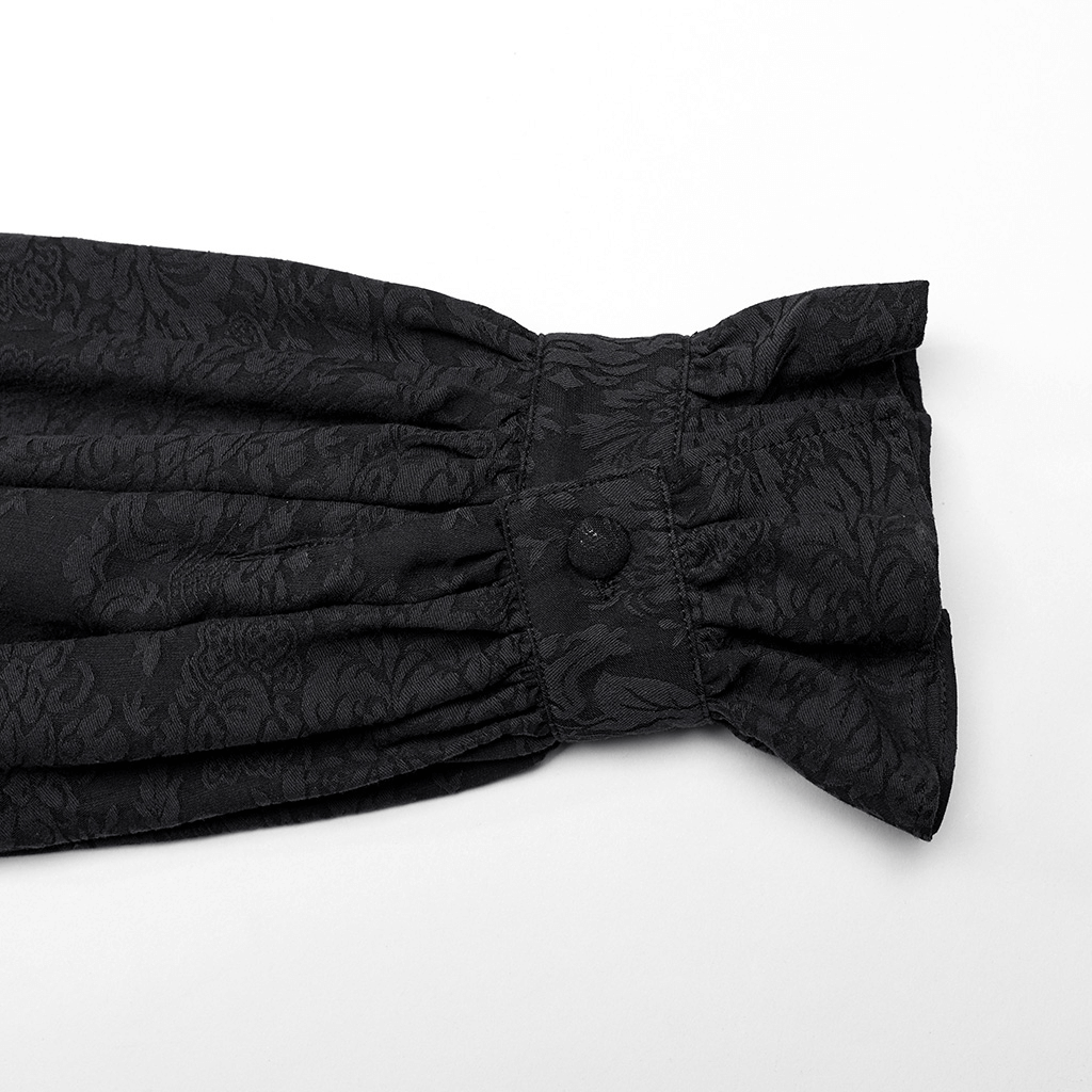 Detail of black jacquard fabric with ruffle at the cuff of a Victorian-inspired male shirt.