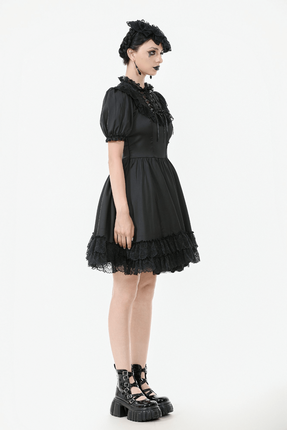 Victorian-inspired black satin lace dress with ruffled sleeves, lace trim, and puff sleeves, perfect for gothic style.