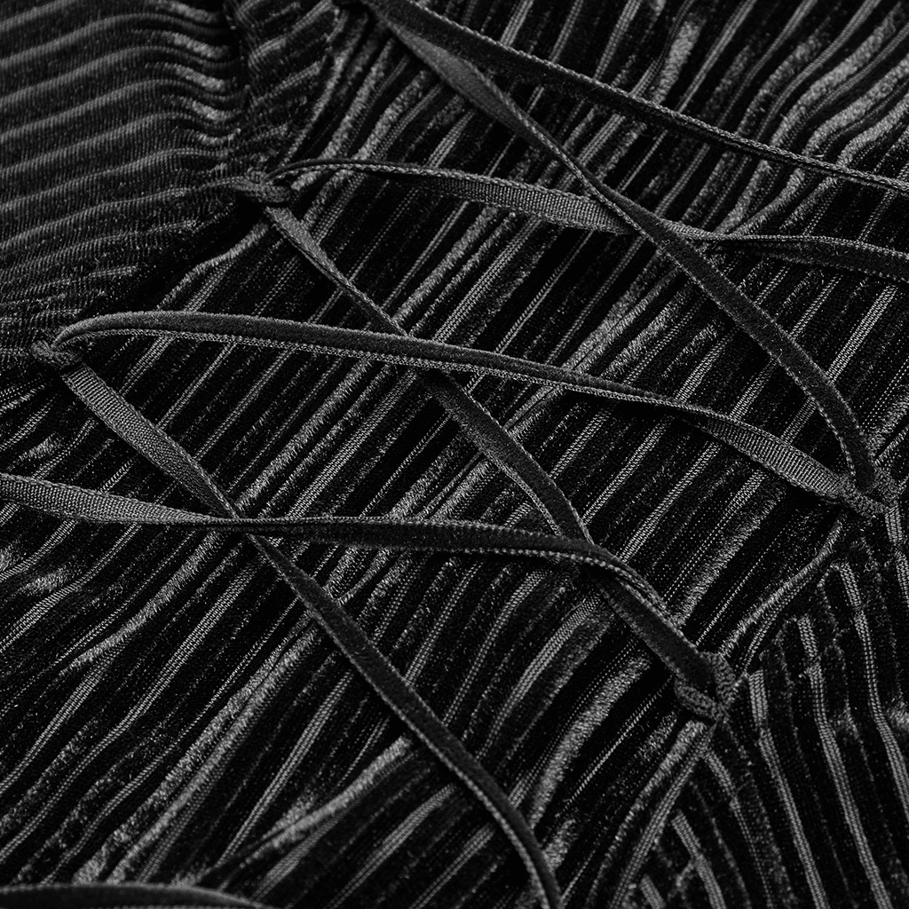 Close-up of striped black velvet fabric with lace detailing showcasing vintage gothic style.
