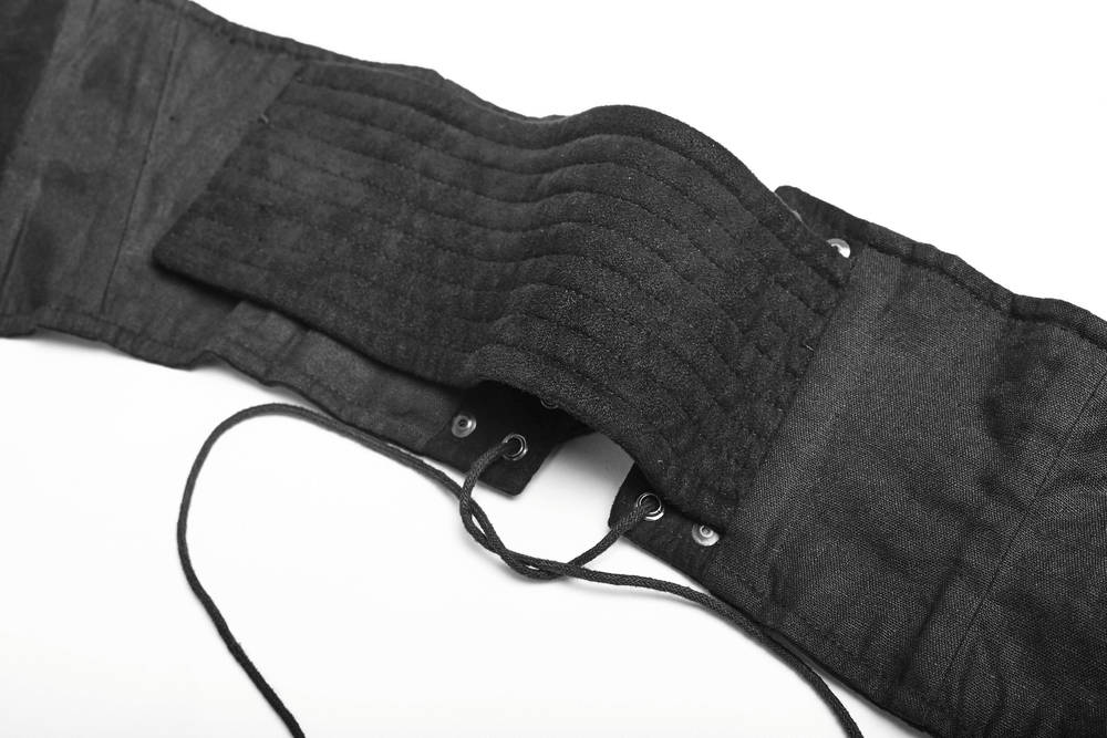 Close-up of a Victorian-inspired studded corset belt, showcasing its buckle loops and adjustable straps.