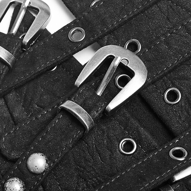 Close-up of Victorian studded corset belt with metal buckles and eyelets on textured fabric.