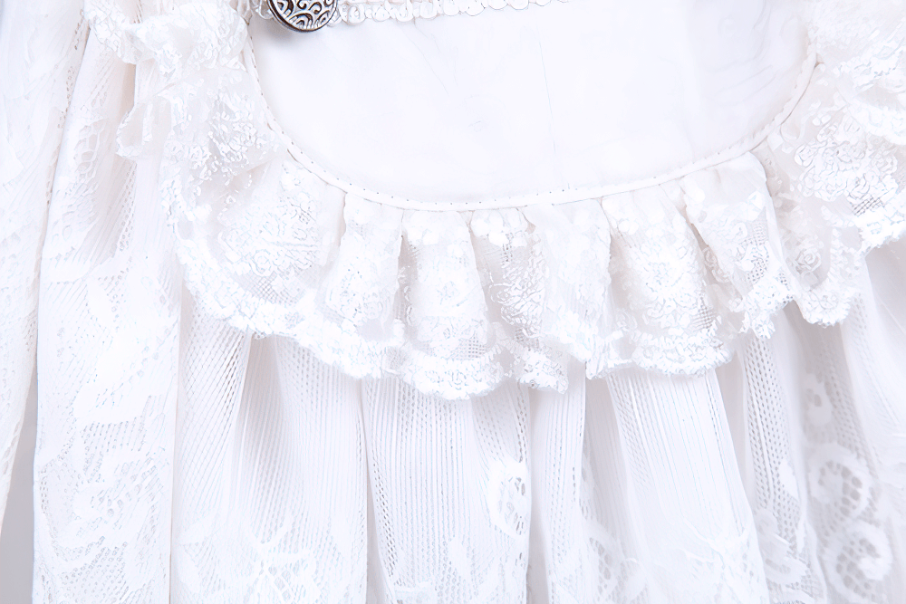 Close-up of intricate lace and ruffle detailing on a Victorian inspired white dress shirt for men.