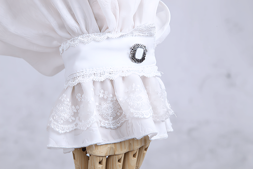 Close-up of the detailed ruffle and lace trim on a Victorian inspired white dress shirt for men.