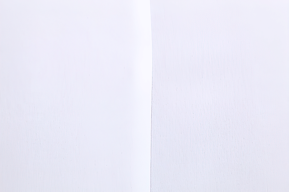 Close-up of soft, airy white chiffon fabric, ideal for Victorian inspired ruffle dress shirts for men.