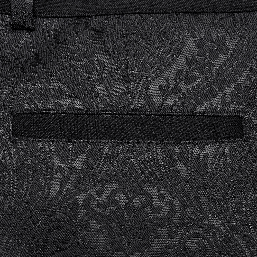 Close-up of intricate black jacquard fabric pattern, showcasing gothic style and elegance.
