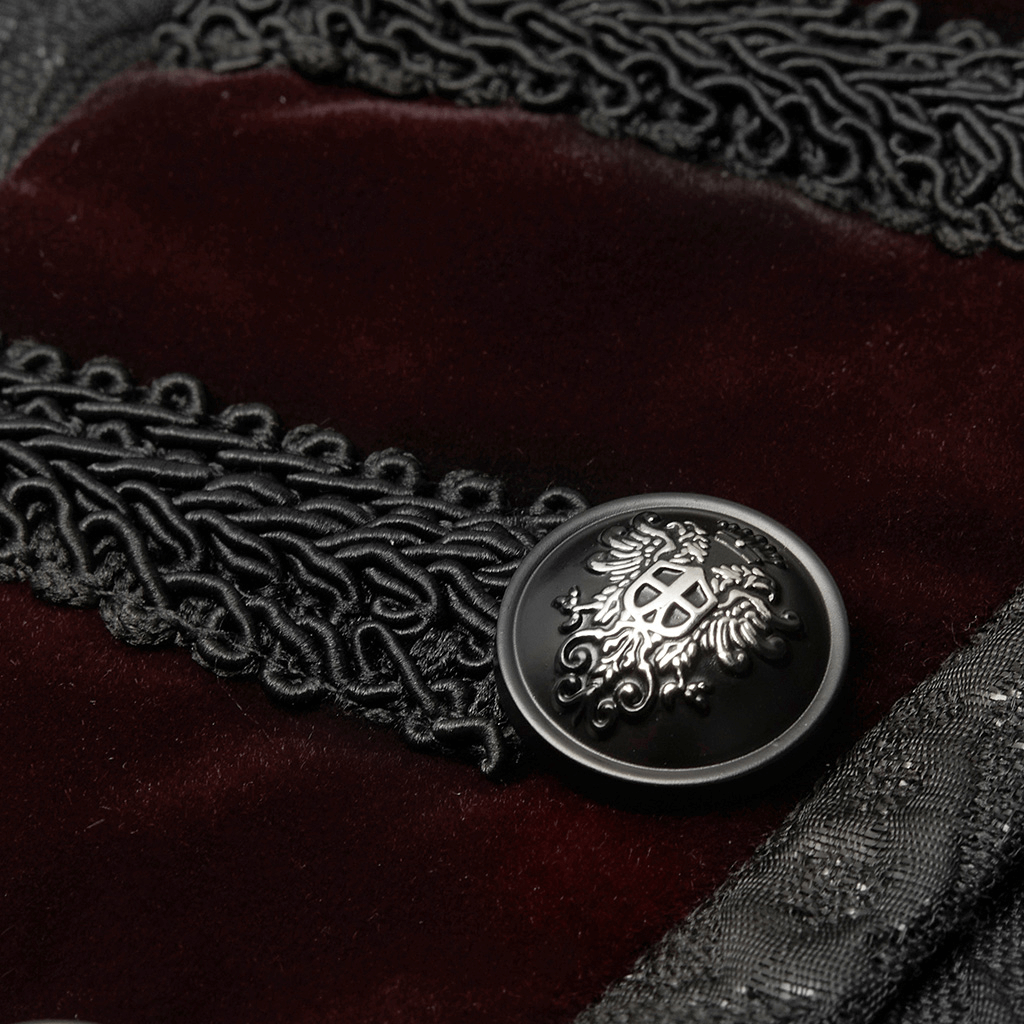 Close-up of a gothic waistcoat featuring intricate jacquard velvet and a decorative button with an ornate design.