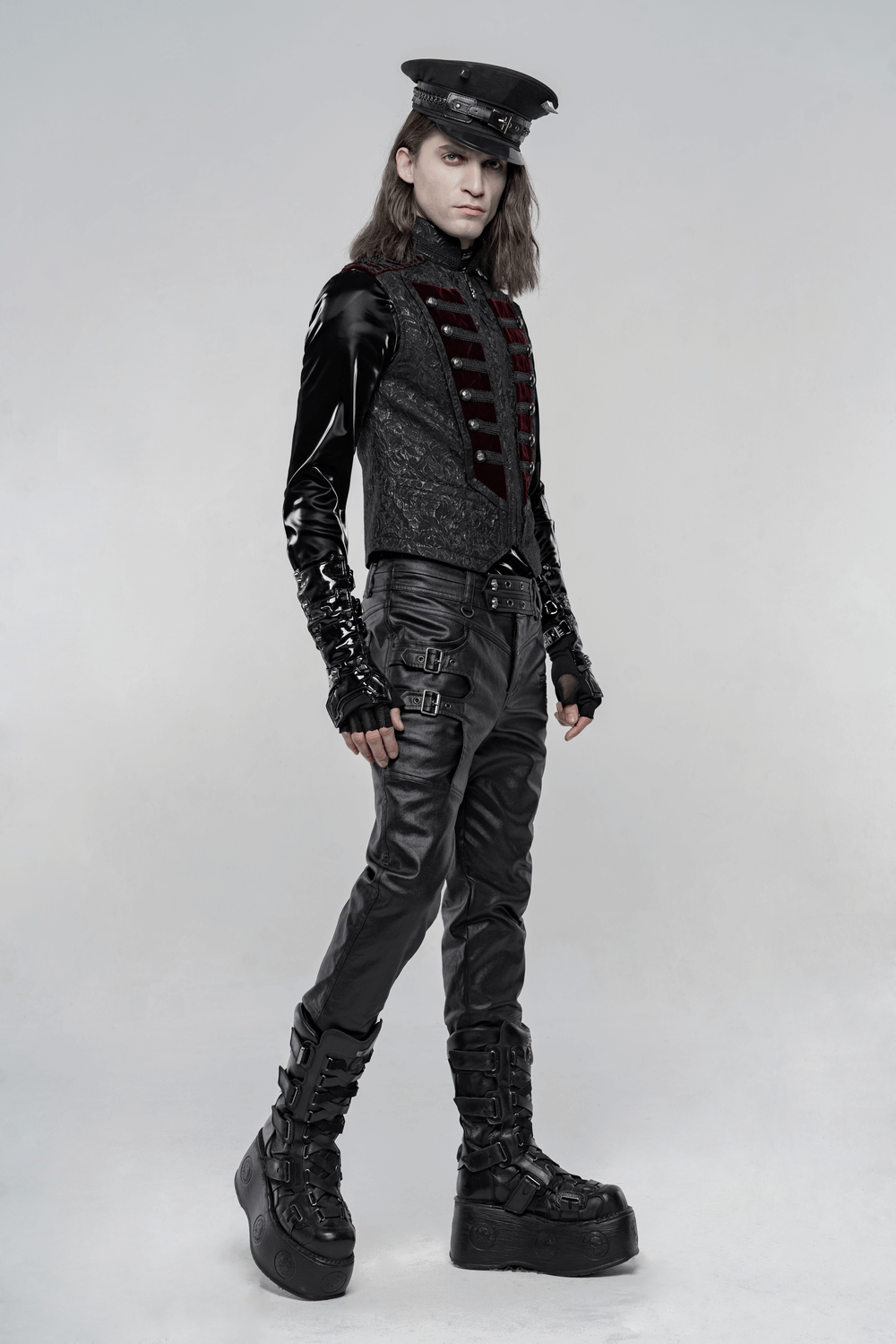 Stylish model in a Victorian Gothic waistcoat with plush velvet and leather details, showcasing bold gothic fashion.