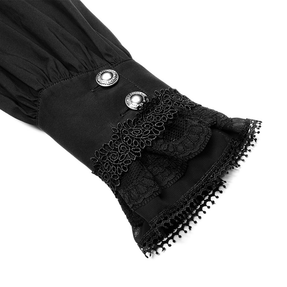 Close-up of black lace cuff with embroidered detail and hand-sewn buttons from a Victorian Gothic shirt.