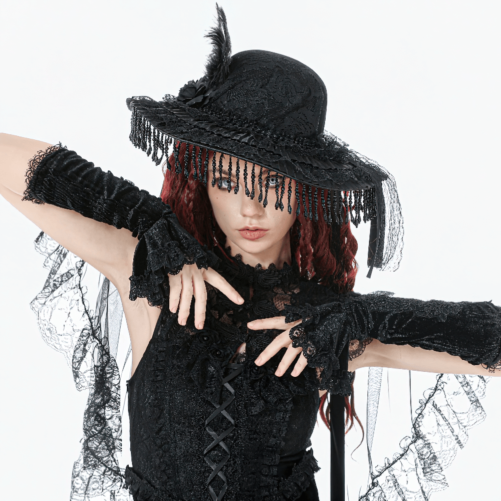 Victorian Lace Hat with Feather and Beaded Fringe worn by model in black lace attire.