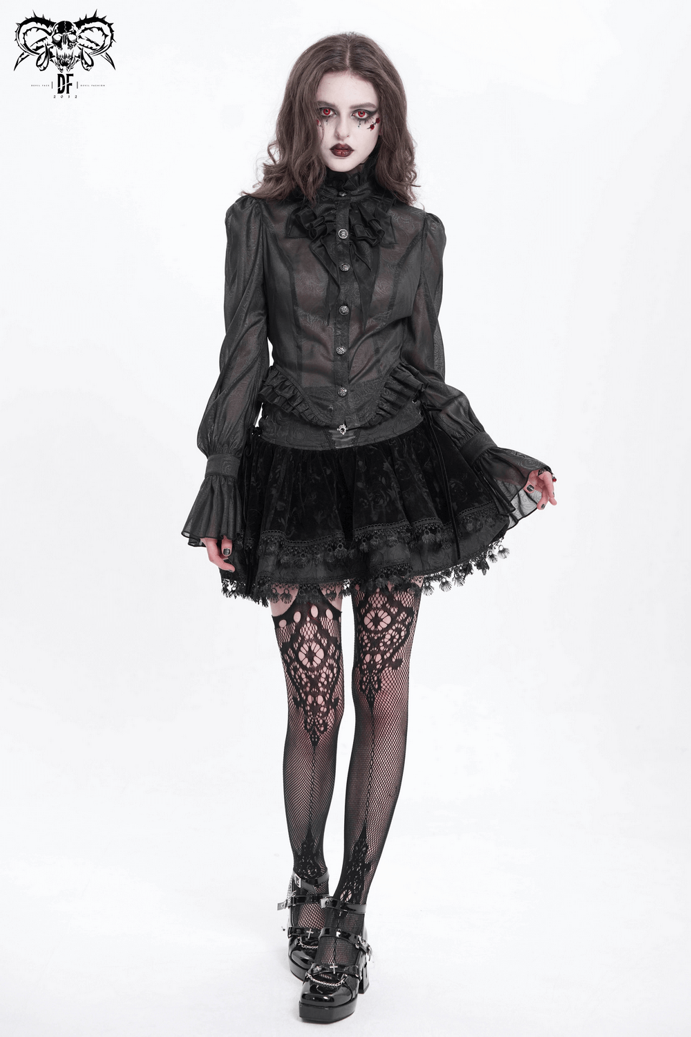 Elegant Gothic model in Victorian lace blouse with ruffles and corset, wearing a layered skirt and lace stockings.