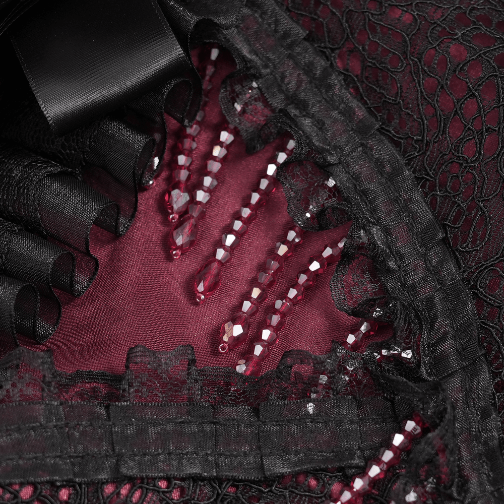 Victorian Lace Ruffled Gothic Cape with Corset Detail interior showing lace and beaded embellishments against crimson fabric.