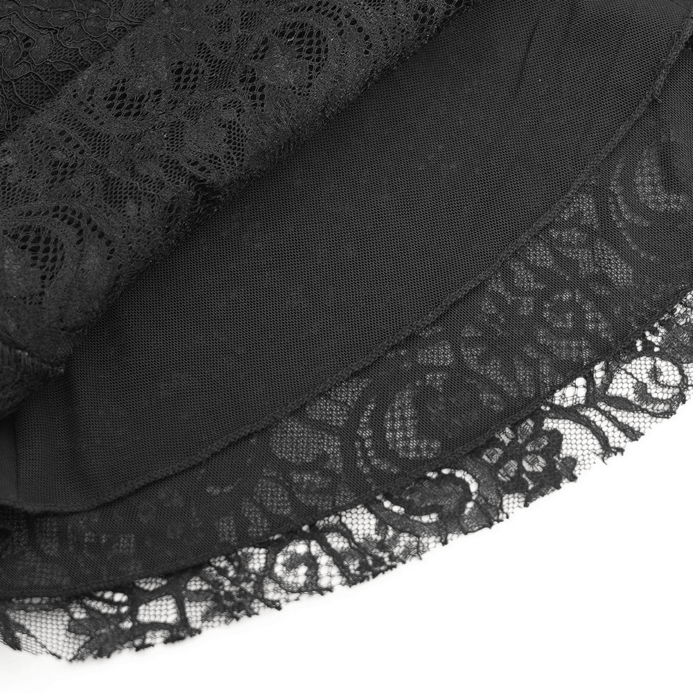 Close-up of delicate black lace and sheer fabric layers for a gothic Victorian blouse.