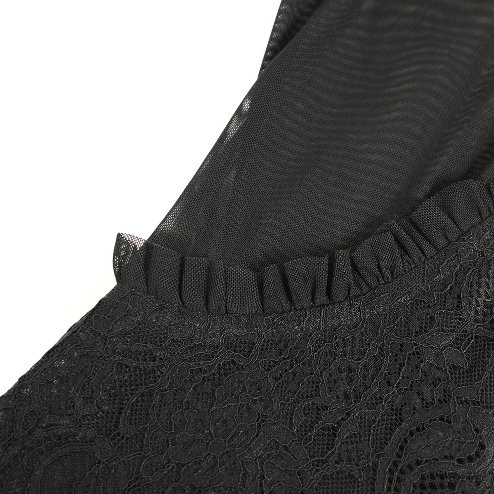 Close-up of Victorian lace top showcasing ruffle details and sheer mesh sleeves in elegant black fabric.