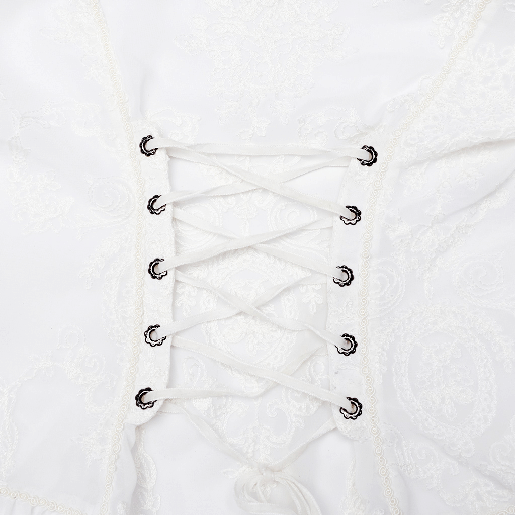 Close-up of Victorian lace-up back detail on a Gothic embroidered blouse with delicate fabric and intricate stitching.