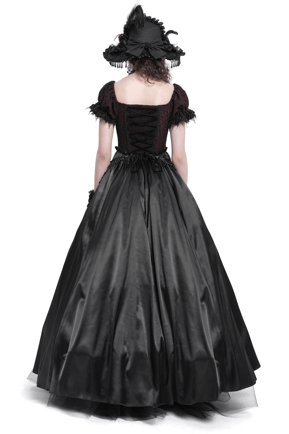 Back view of a Victorian lace-up dress, featuring a black skirt and burgundy bodice with ruffled details and a matching hat.