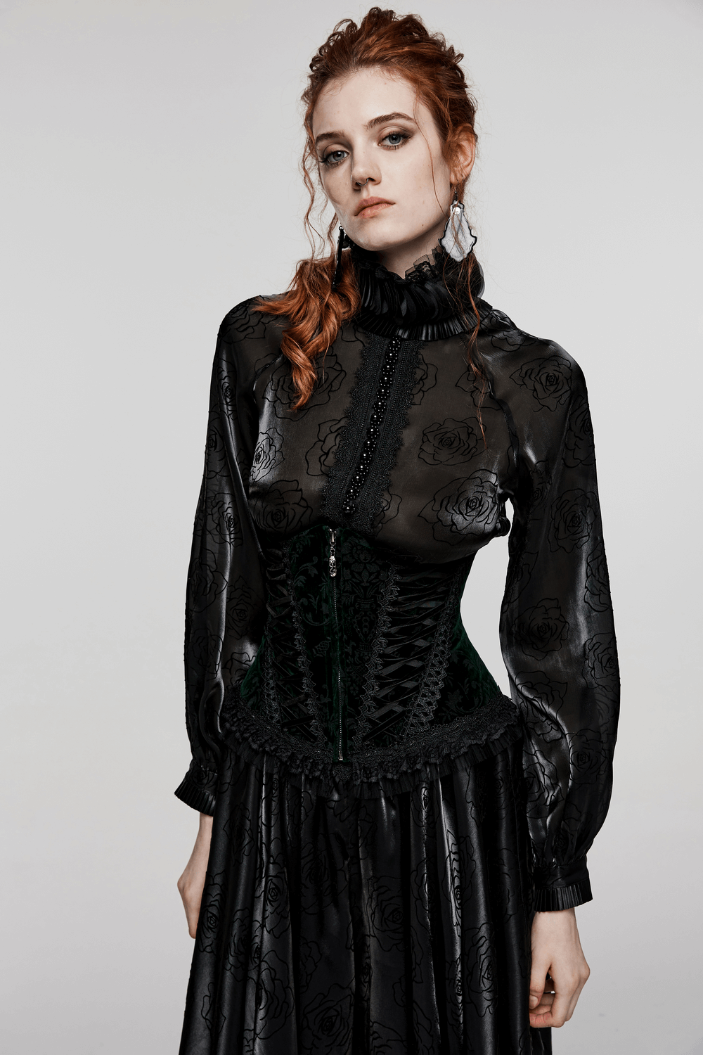 Victorian lace-up velveteen gothic corset worn by a model, featuring elegant lace and floral patterns.