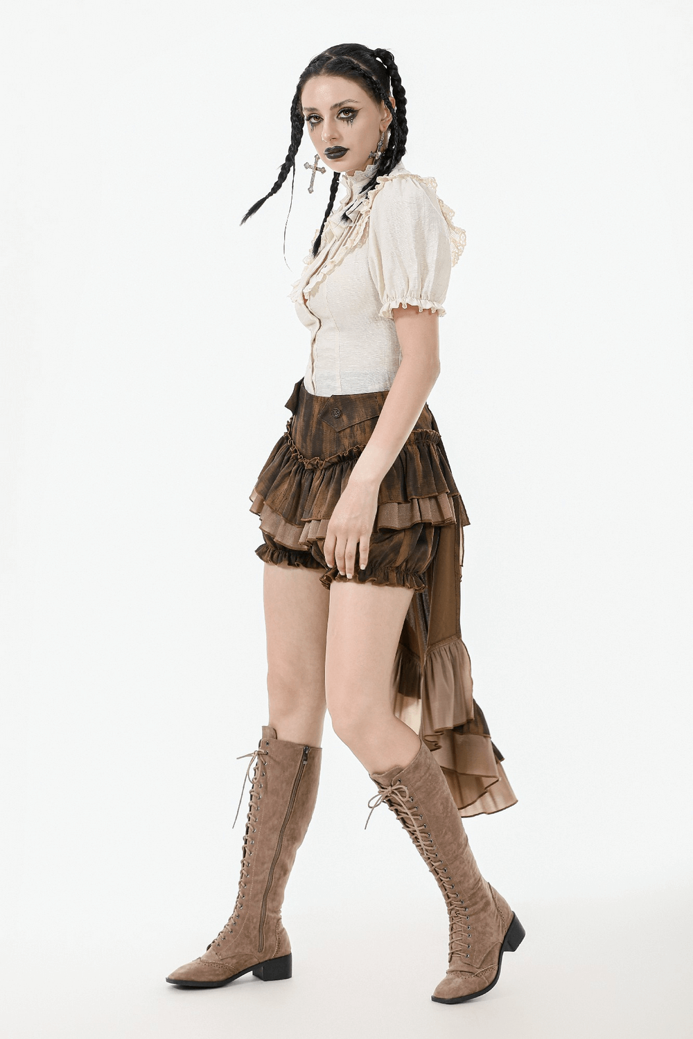 Vintage-inspired Victorian blouse with puff sleeves, styled with a layered ruffle skirt and knee-high lace-up boots.