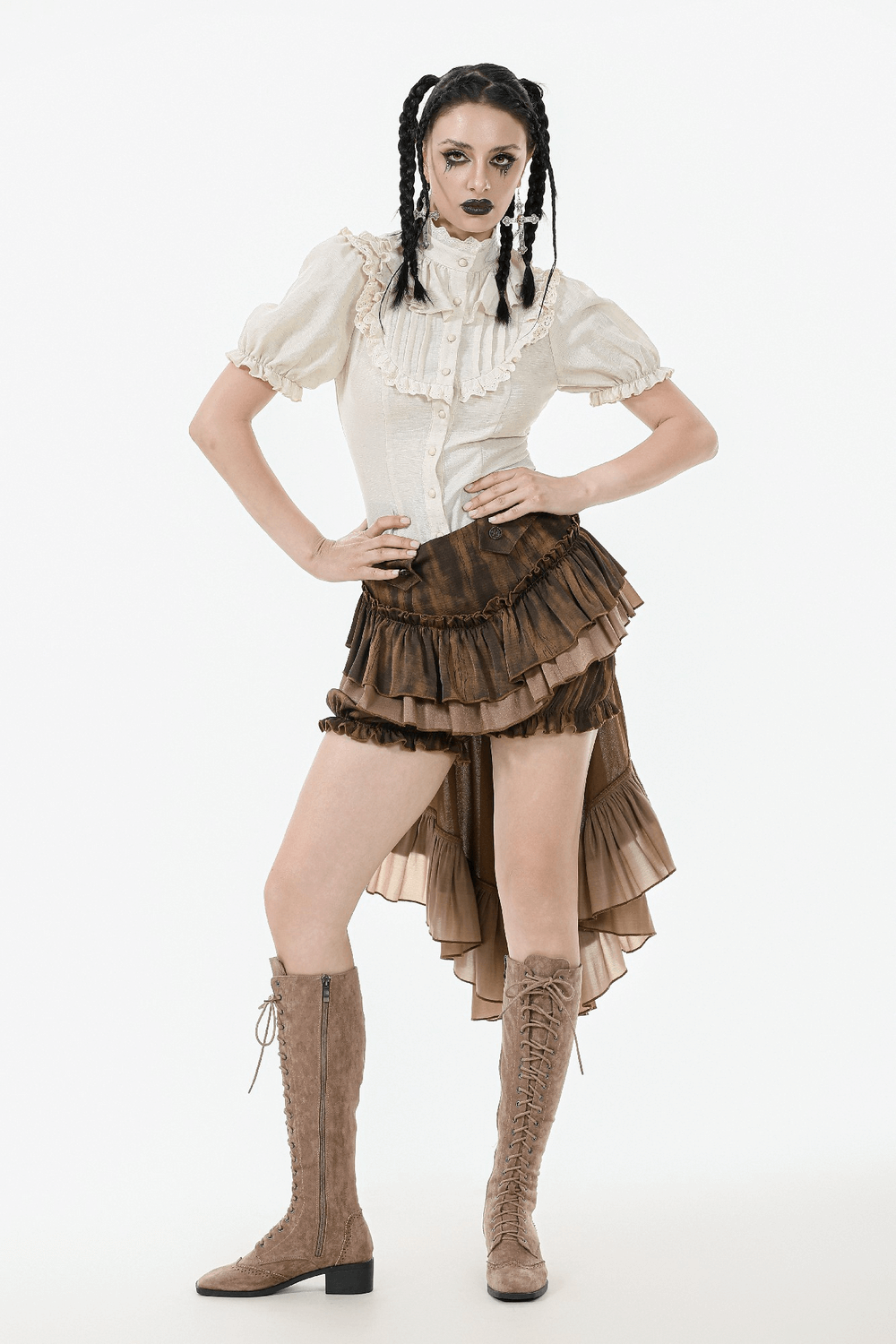 Victorian-inspired puff-sleeved blouse with lace and ruffle details, paired with a layered skirt and boots.