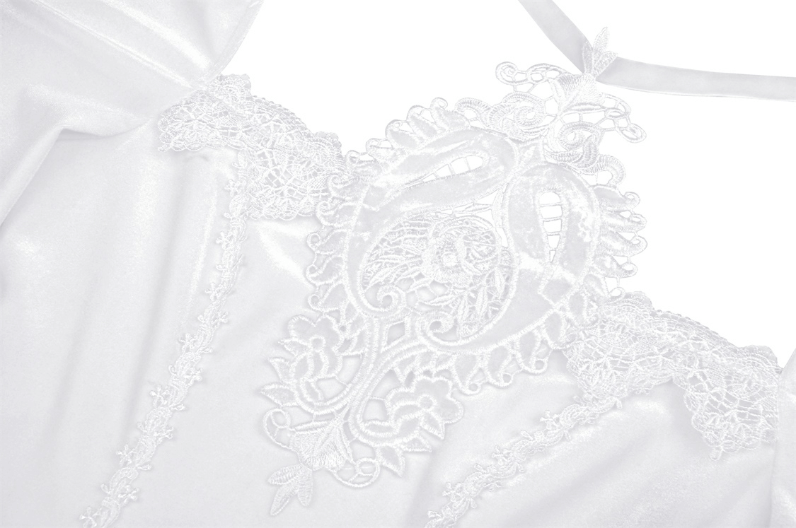 Intricate white lace detailing on a Victorian-inspired dress, showcasing gothic elegance and romantic style.
