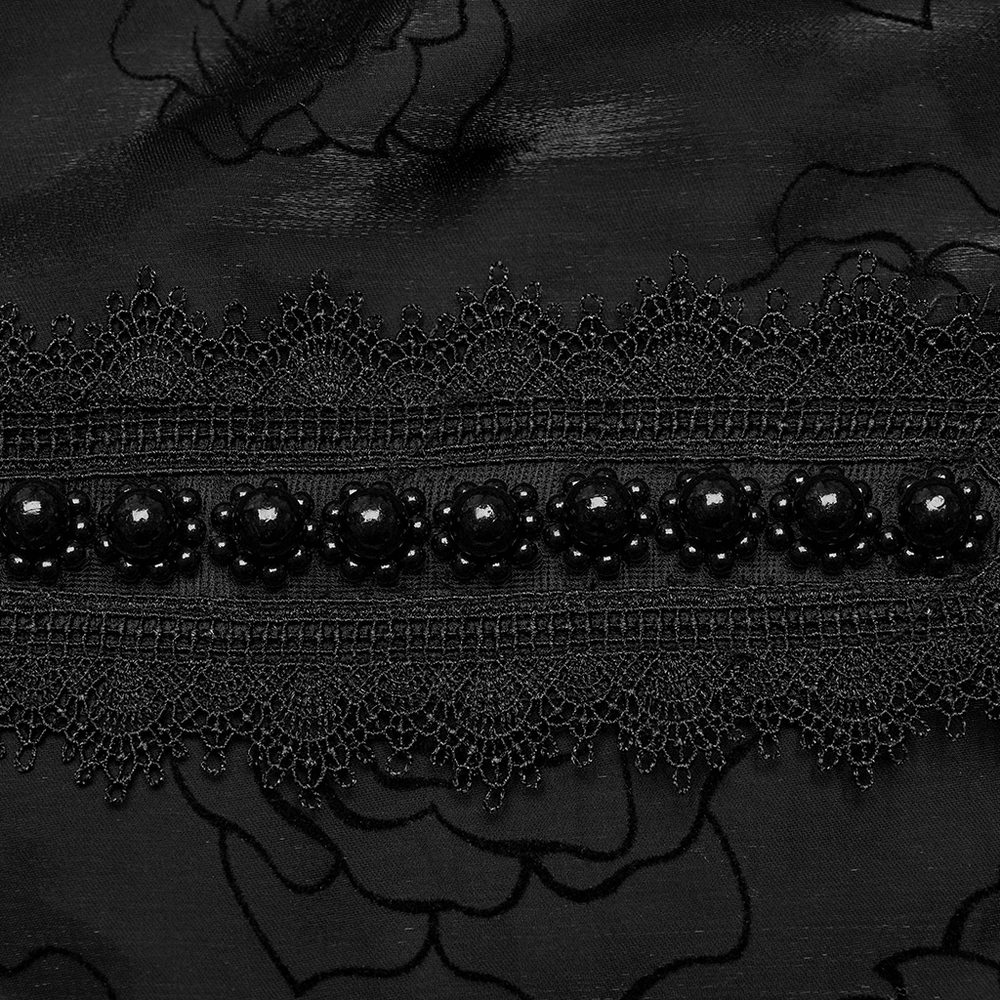 Close-up of intricate black lace and rose flock mesh, featuring beaded embellishments for a gothic style.