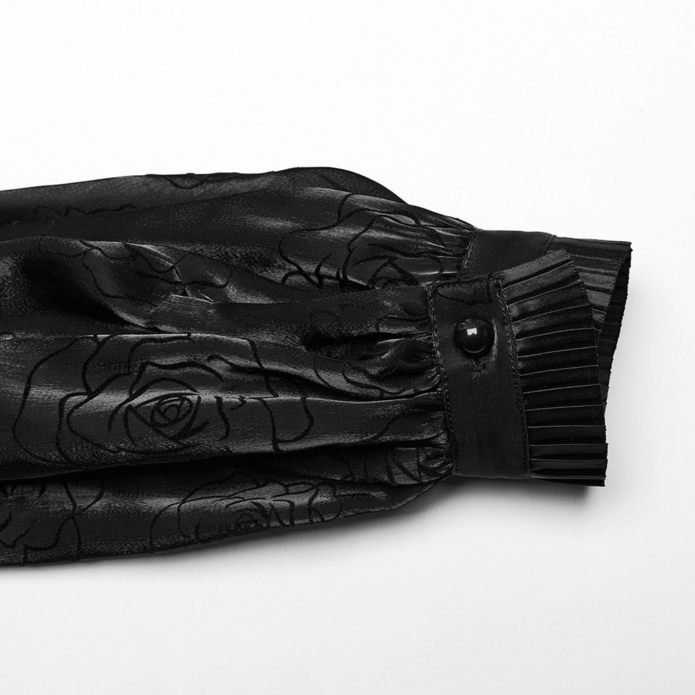 Close-up of Victorian Rose Flock Mesh Gothic shirt sleeve with ruffle and button detail, showcasing dark romantic elegance.