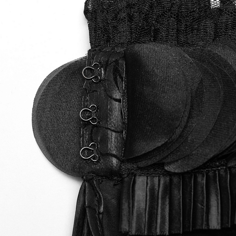 Close-up of the elegant hook and ruffle details on a Victorian Gothic shirt