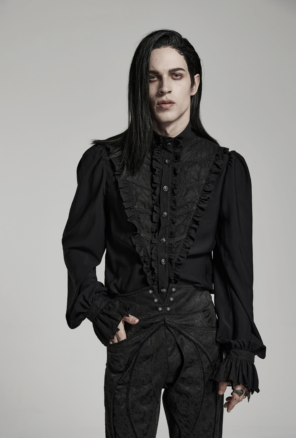 Elegant Victorian ruffle black gothic shirt showcasing intricate ruffles and puff sleeves for a striking gothic look.