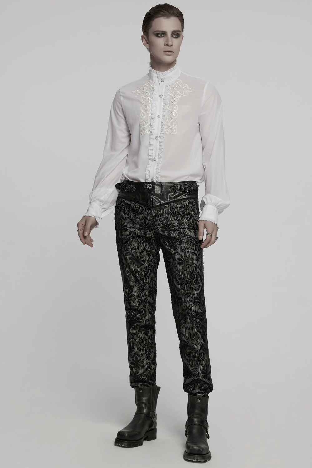 Victorian ruffle shirt with gem buttons, elegant embroidery, styled with gothic pants and boots.