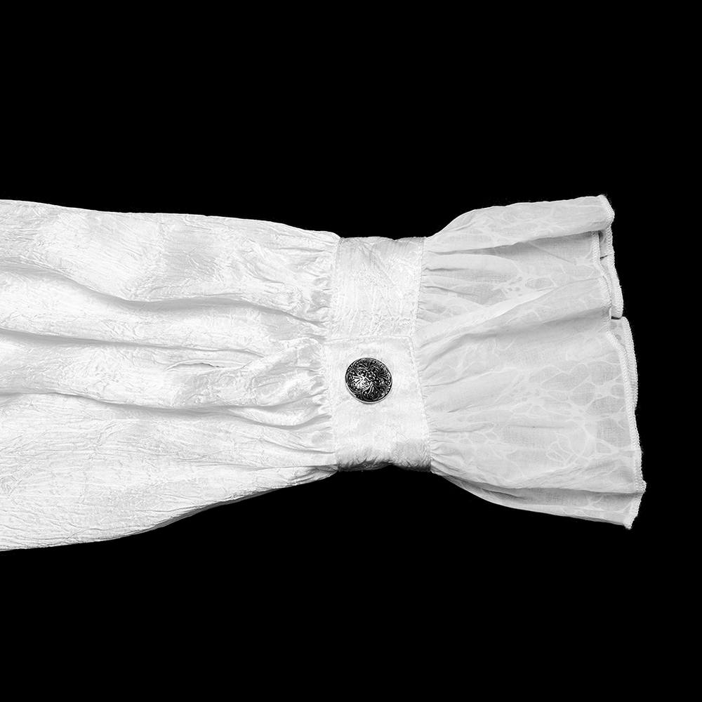 Close-up of the Victorian ruffled white shirt cuff featuring elegant gothic button and textured lace fabric.