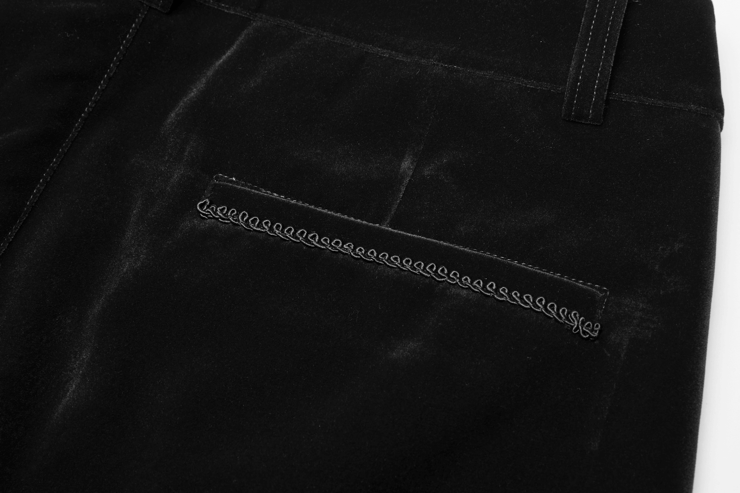 Close-up of the back pocket detail on Victorian Black Velvet Gothic Trousers with intricate embroidery.