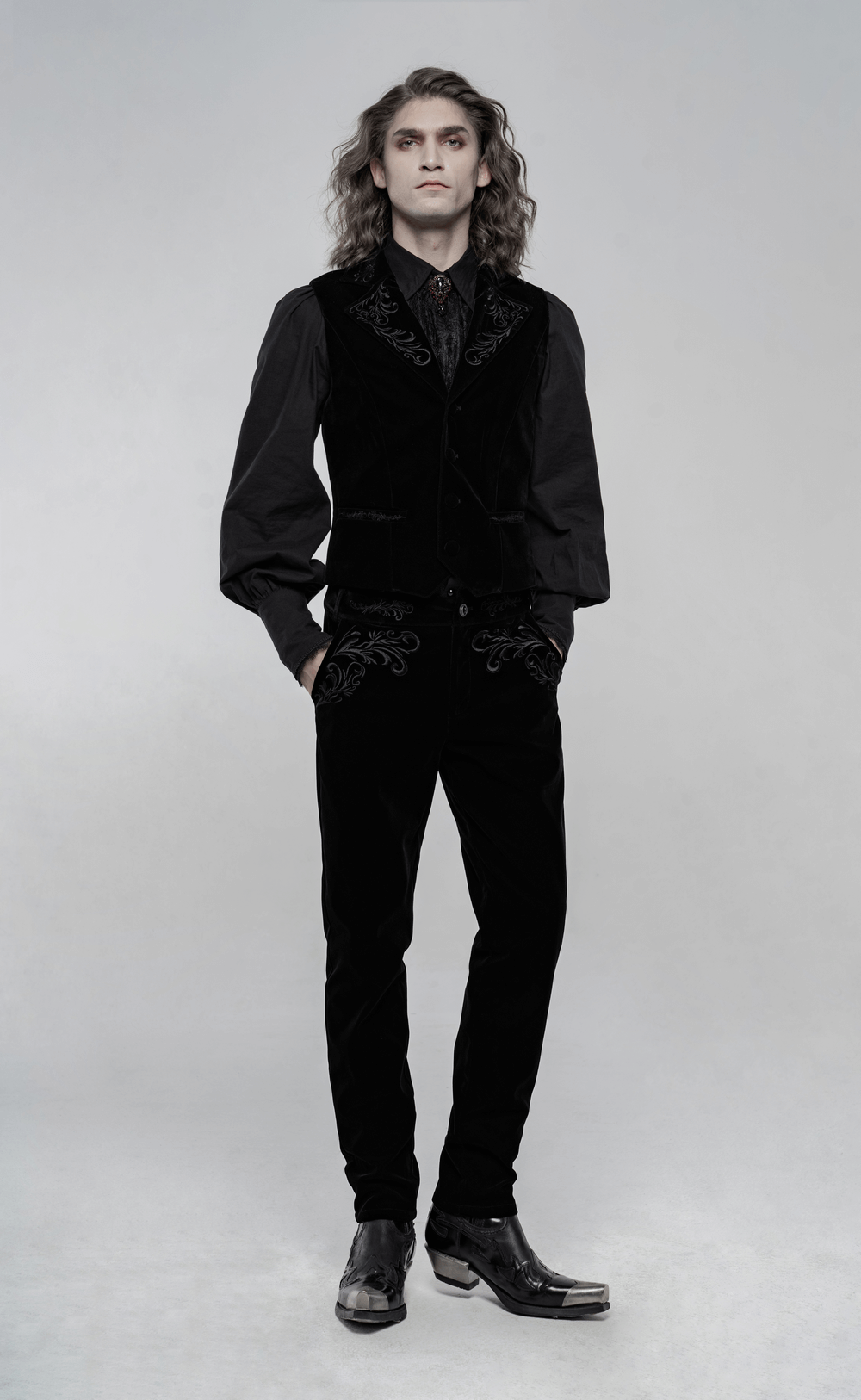 Victorian style embroidered black velvet trousers with gothic details, stylishly paired with a matching shirt and boots.