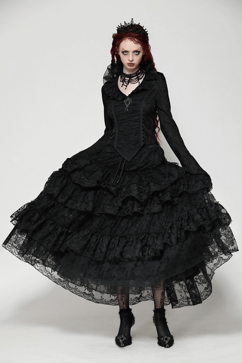 Elegant gothic woman in black ruffled dress with lace, styled with dark accessories and dramatic makeup. Perfect for vintage looks.