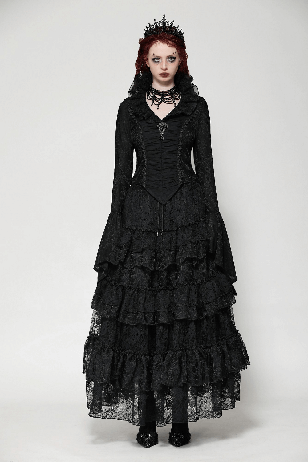 Elegant gothic dress with layered lace, dramatic sleeves, and a corset bodice for a timeless vintage-inspired look.