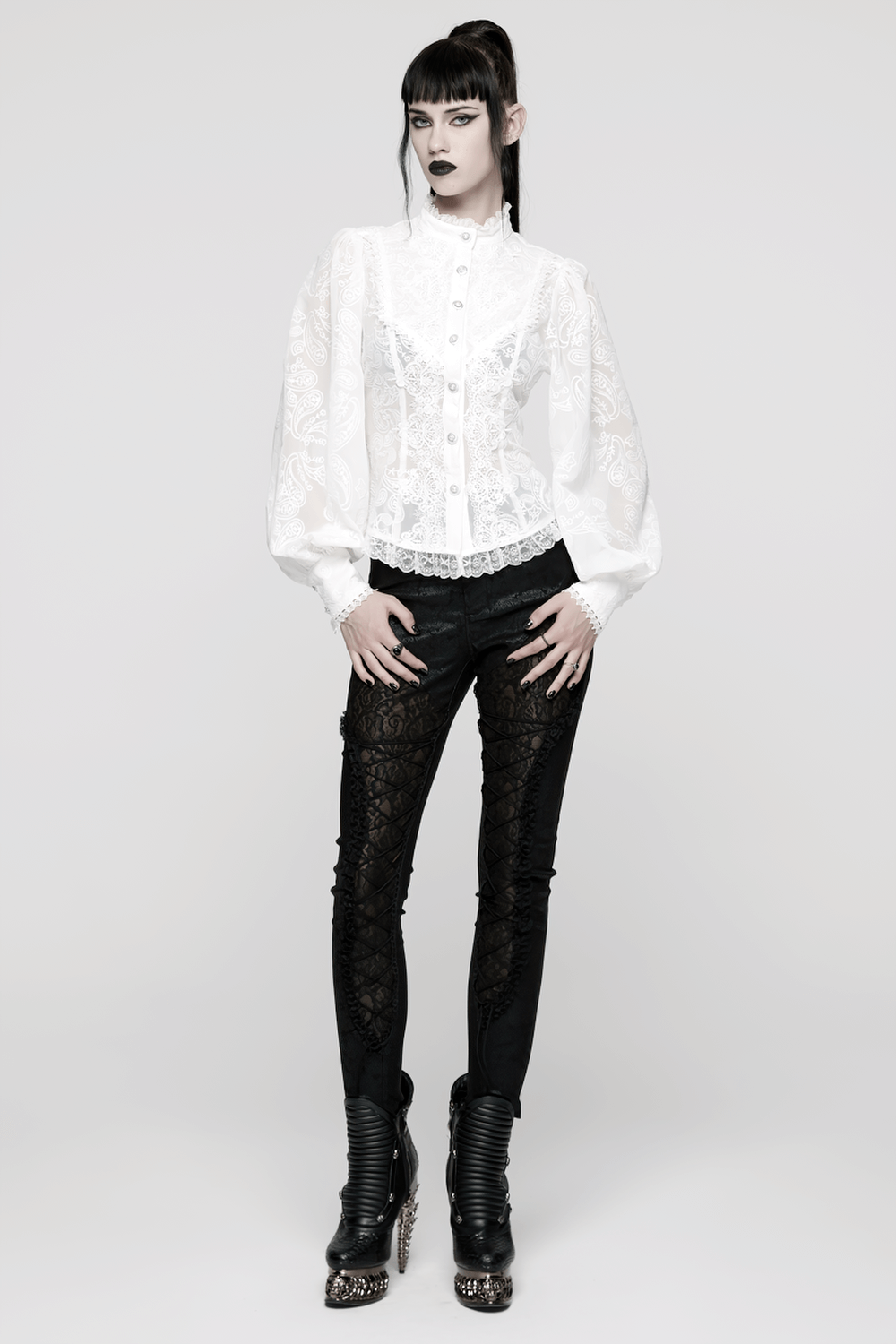Victorian White Lace Gothic Chiffon Long Sleeve Blouse worn with stylish black lace leggings in a striking pose.