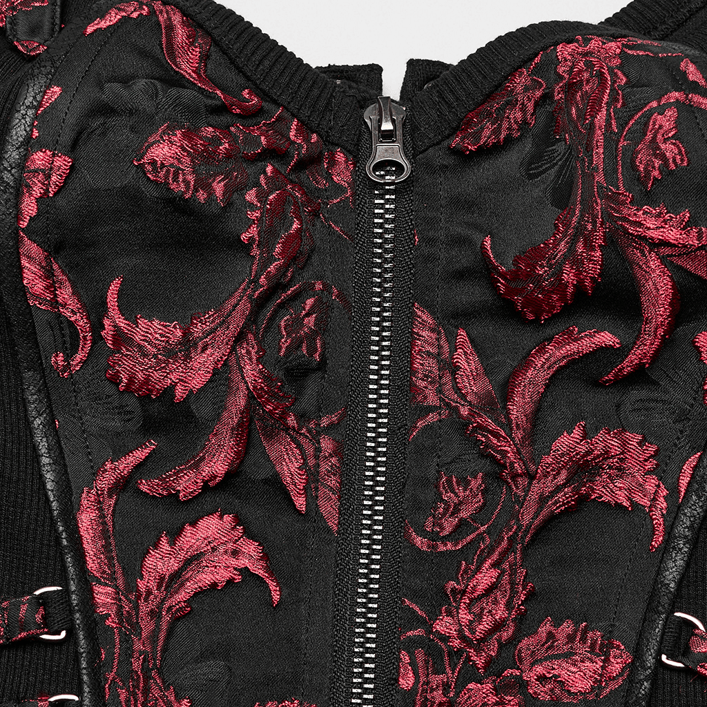 Close-up of a black steampunk waistcoat featuring intricate red floral embroidery and a front zipper.