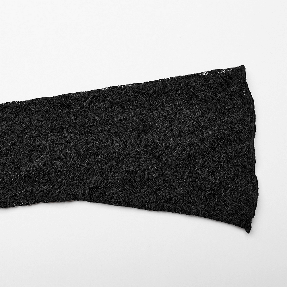 Close-up of elegant black lace fabric with intricate wave pattern, perfect for Gothic fashion accents.