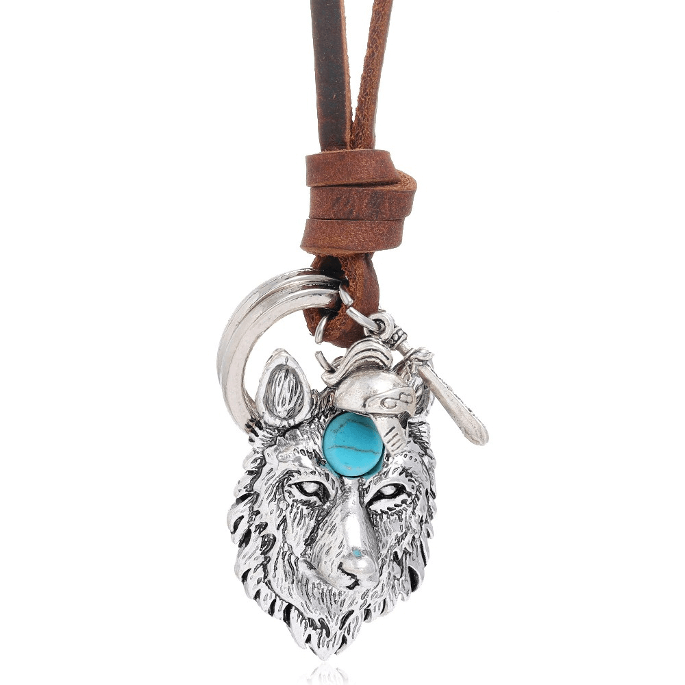 Vintage brown leather necklace with detailed silver wolf head pendant and turquoise accent.