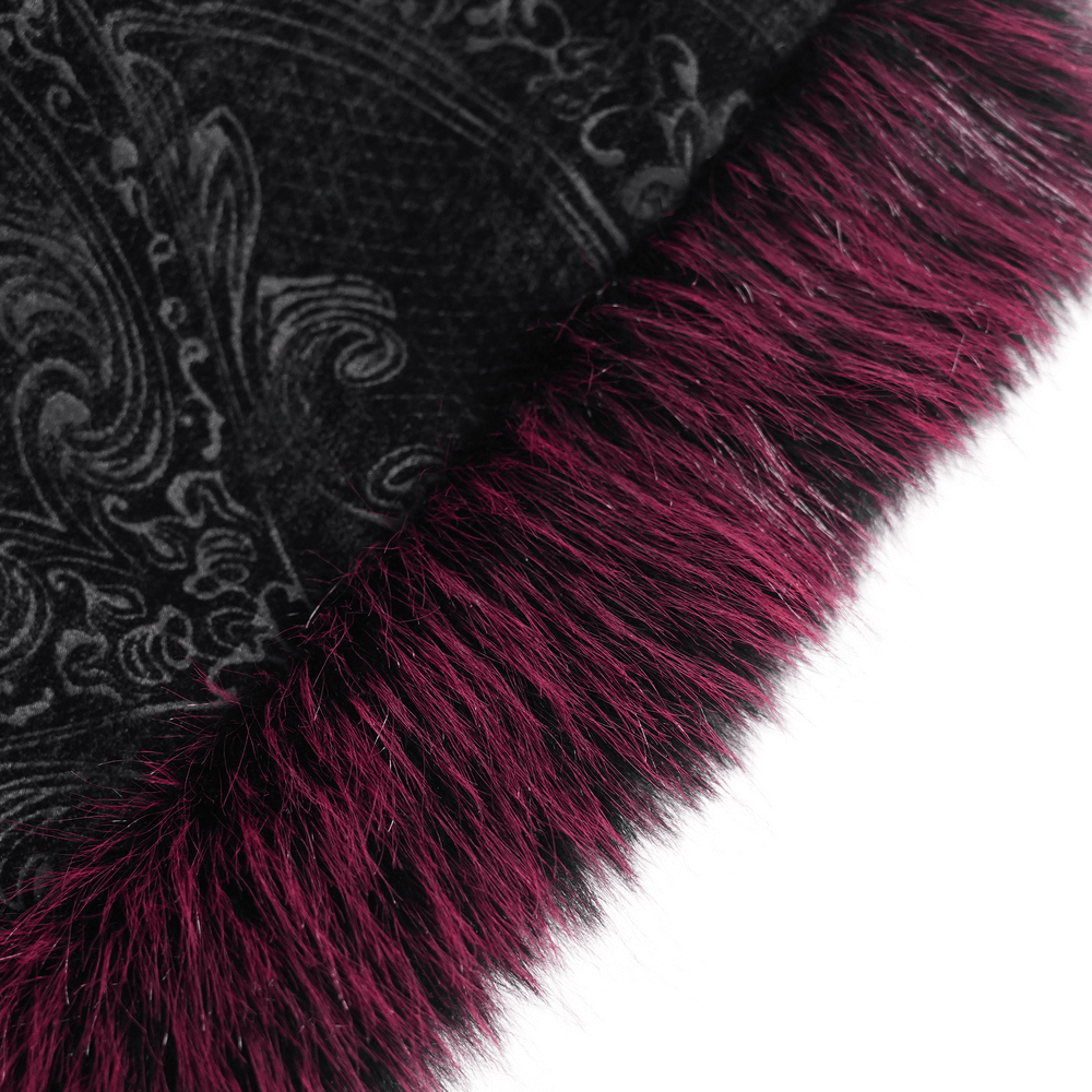 Close-up of burgundy faux fur trim on a vintage black velvet coat, showcasing intricate lace patterns.