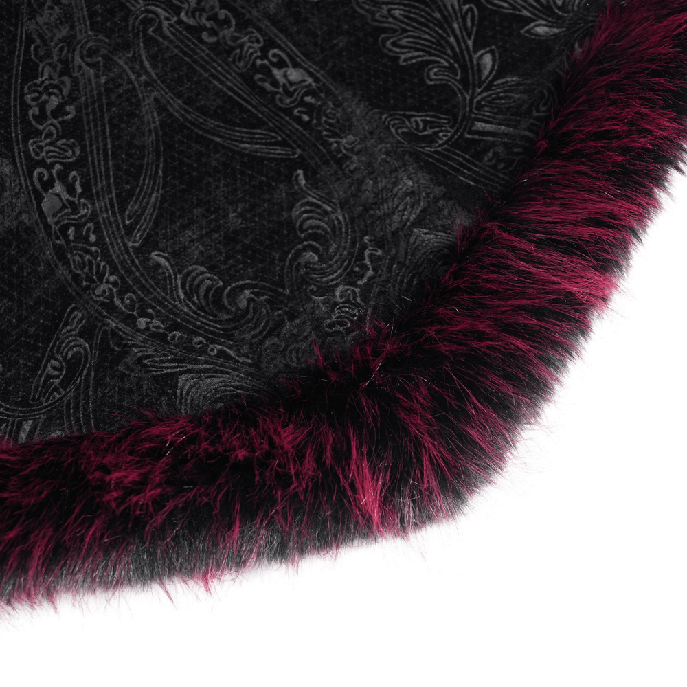 Close-up of black velvet fabric with intricate lace design and burgundy faux fur trim, showcasing luxurious detail.
