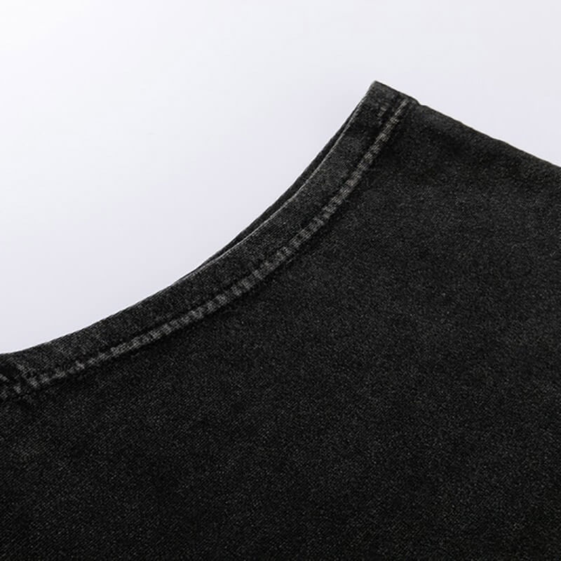 Close-up of the neckline of a vintage black cotton tank top, showcasing its soft fabric and gothic style details.