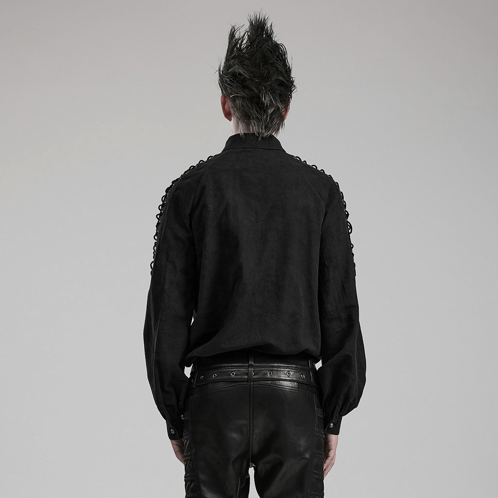 Back view of a man in a vintage black lace-up gothic shirt showcasing eyelet drawstring details.