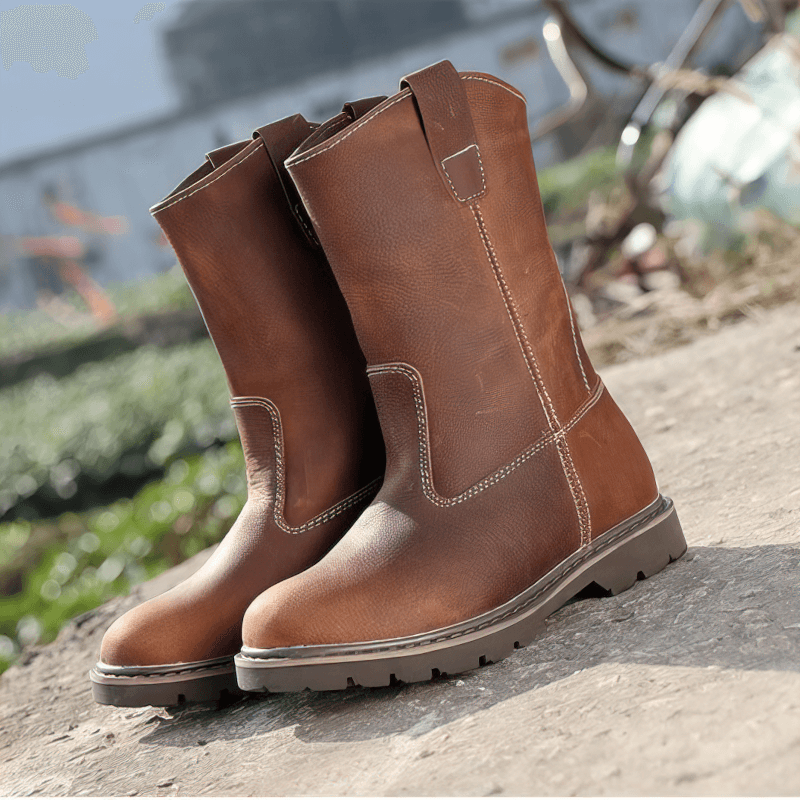 Stylish vintage buckle boots in brown leather for men, featuring a flat sole and rugged design, perfect for rocker fashion.