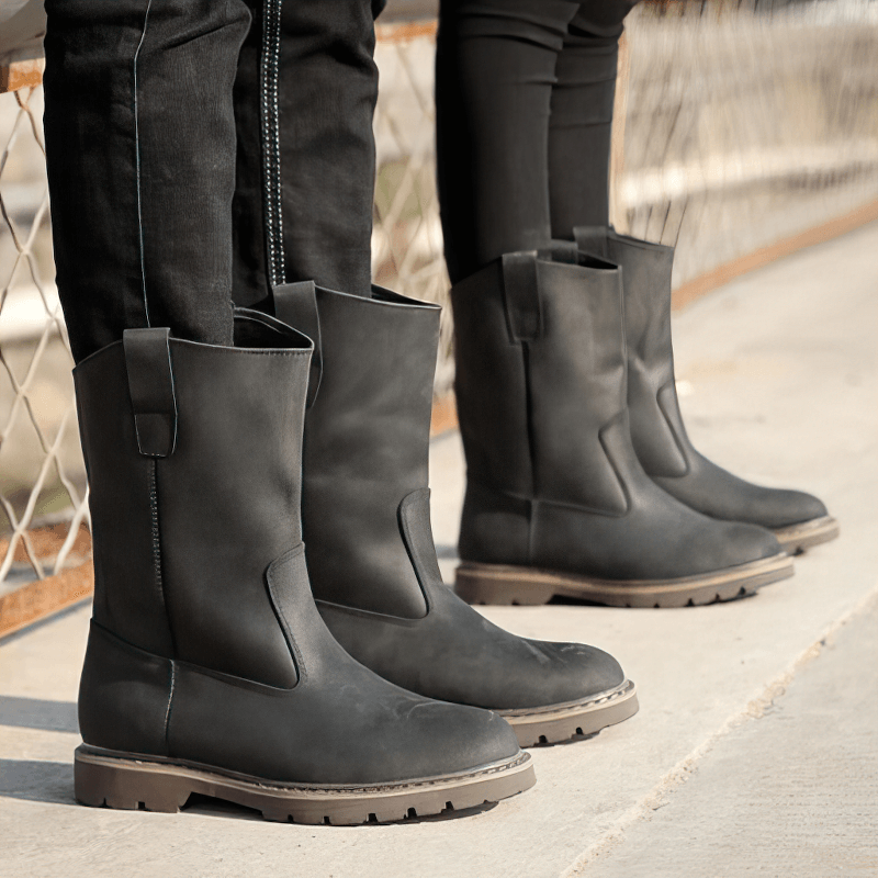 Stylish vintage buckle boots for men, featuring genuine leather, rounded toe, and flat tractor tread sole.