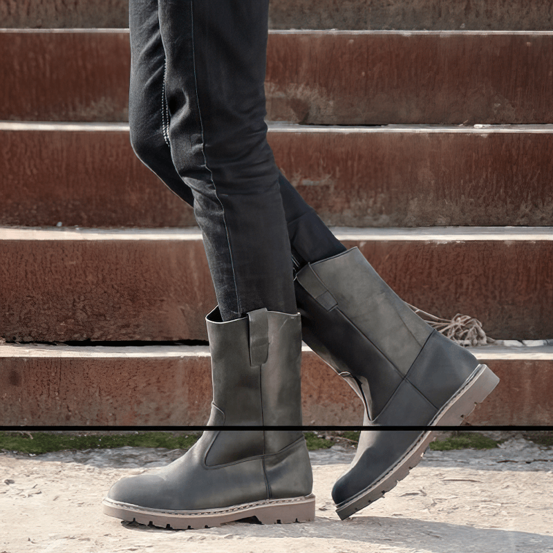 Men's vintage buckle boots in gray, perfect for a rock style outfit, featuring a flat sole and tractor tread for comfort.