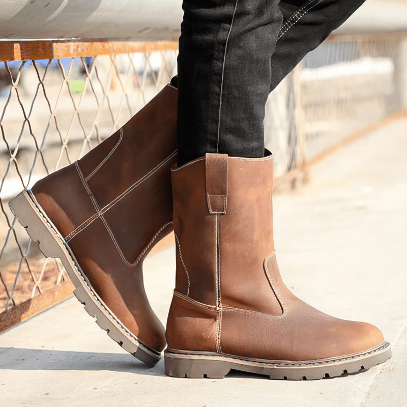 Vintage buckle boots in brown leather, featuring a rounded toe and stylish flat sole, perfect for rock-inspired outfits.