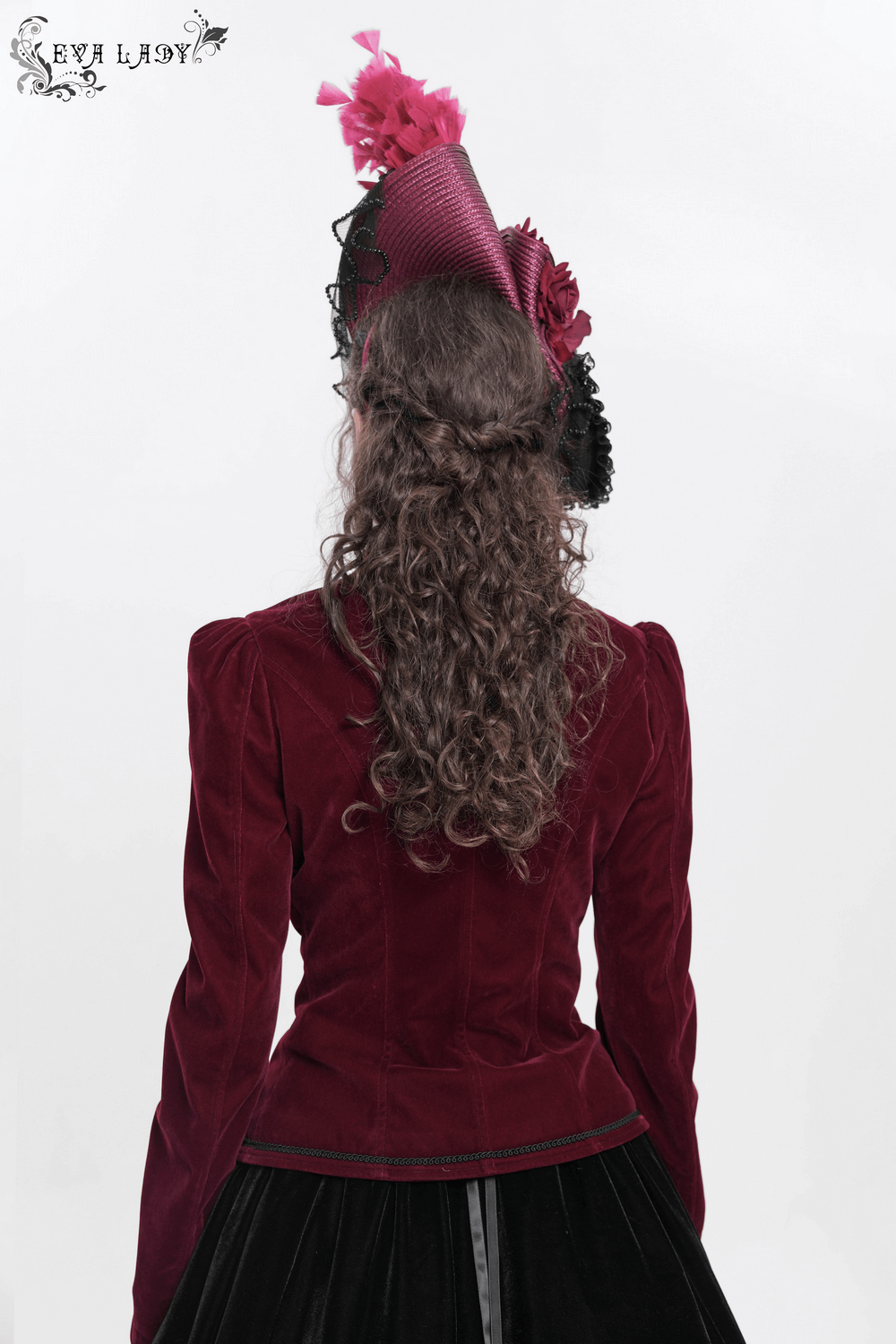 Vintage burgundy fascinator hat with feathers and lace, worn from behind, adding dramatic flair for special occasions.