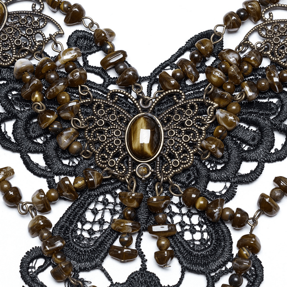 Vintage butterfly necklace featuring natural stones and intricate lace details for a bold, elegant look.
