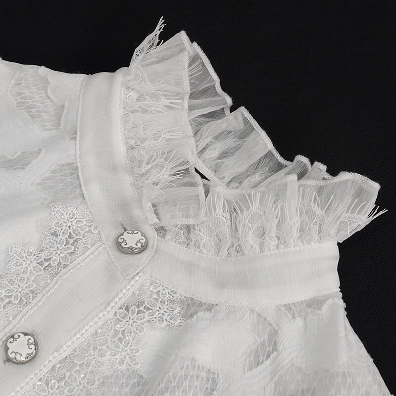 Close-up of vintage white chiffon blouse with lace inserts and ruffled high collar, featuring decorative buttons.